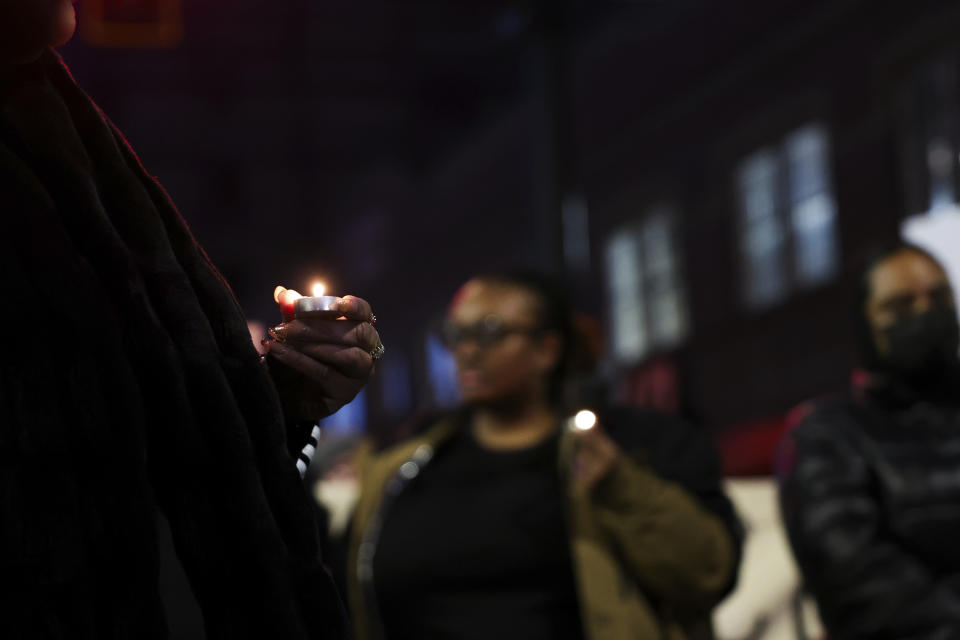 Protestors hold candles during a rally after the verdict was read for the trial of three Tacoma Police officers in the killing of Manny Ellis, at Pierce County Superior Court, Thursday, Dec. 21, 2023, in Tacoma, Wash. (AP Photo/Maddy Grassy)