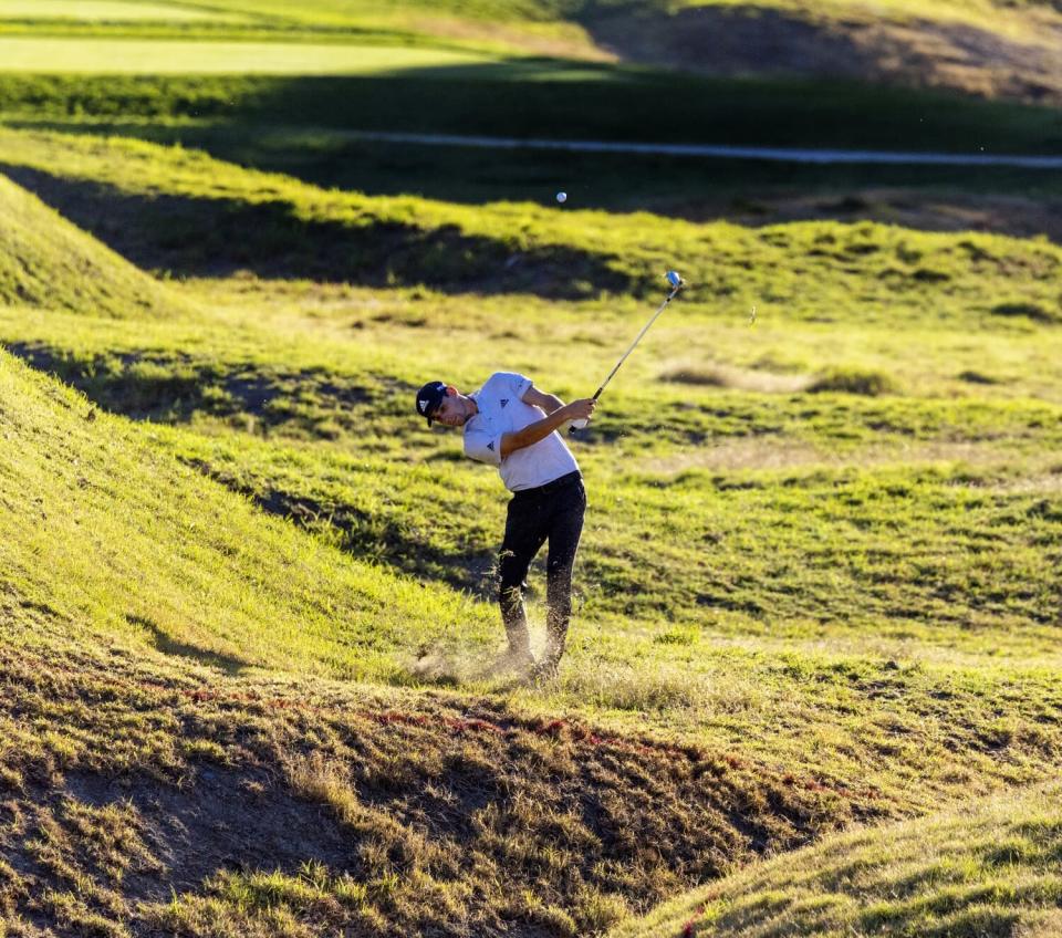 Leader Joaquin Niemann hits out of the rough on the eighth hole during the first round of the Genesis Invitational.