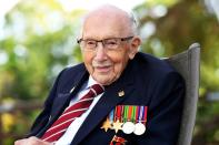 FILE PHOTO: Captain Sir Tom Moore smiles as he launches his autobiography at his home in Milton Keynes