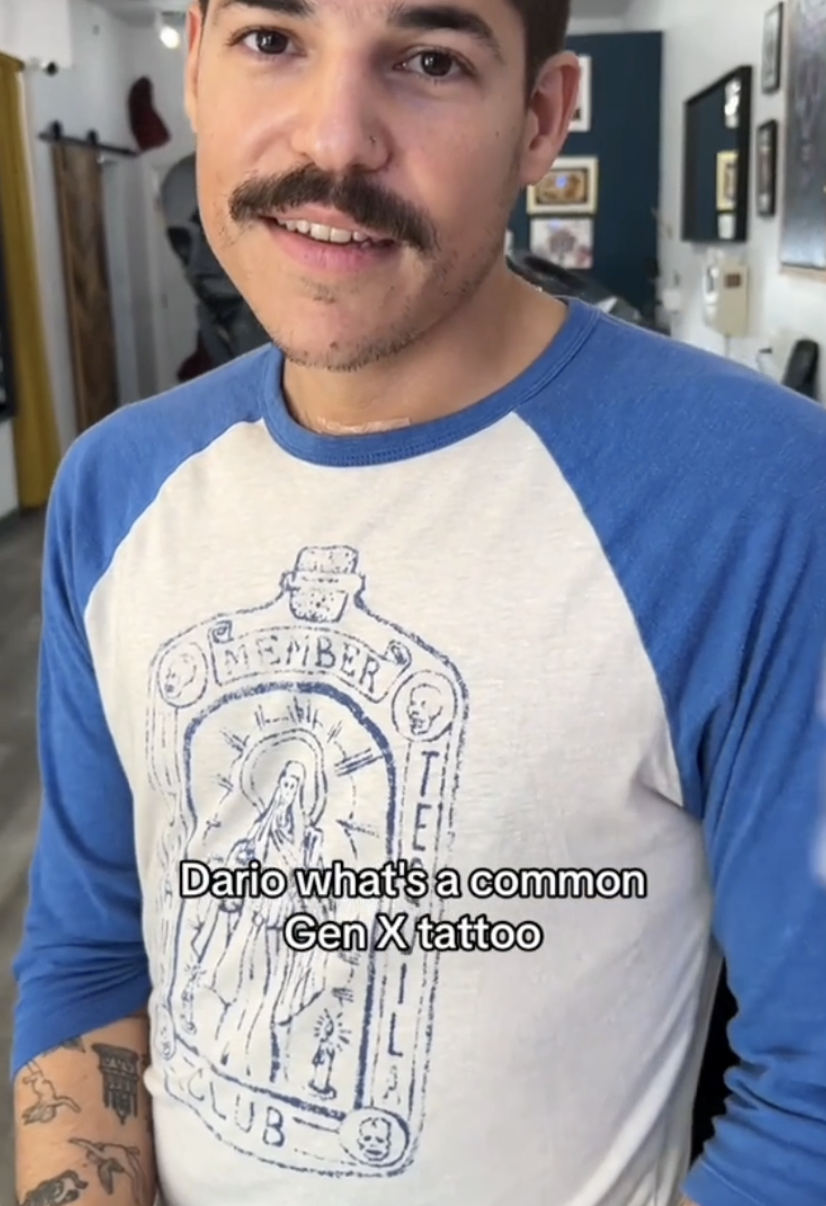 Man in a graphic tee smiling, with text asking about a common Gen X tattoo
