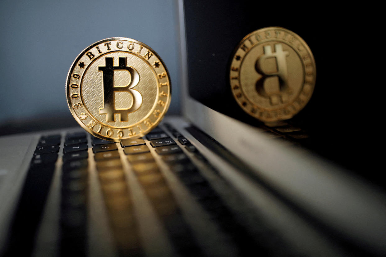 FILE PHOTO: A bitcoin is seen in an illustration picture taken at La Maison du Bitcoin in Paris, France, June 23, 2017. REUTERS/Benoit Tessier/File Photo/File Photo