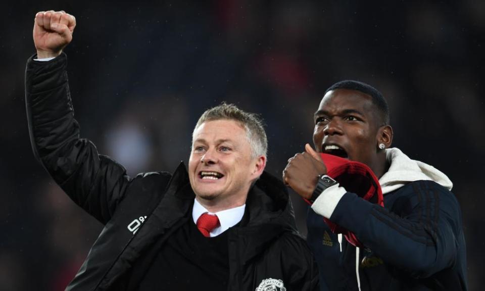 Ole Gunnar Solskjær and Paul Pogba celebrate Manchester United's dramatic win at PSG in March 2019