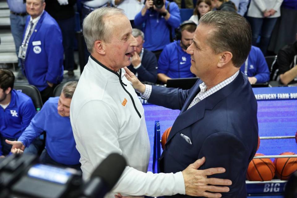 Tennessee coach Rick Barnes, left, shakes hands with Kentucky coach John Calipari prior to Saturday’s game at Rupp Arena.