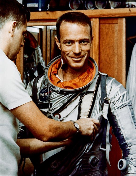 Astronaut M. Scott Carpenter, prime pilot for the Mercury-Atlas 7 flight, is seen in Hanger S crew quarters during a suiting exercise in 1962.