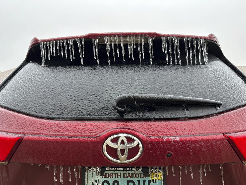 Ice coats a vehicle in Bismarck, N.D., on Tuesday, Dec. 26, 2023. An ice storm, part of a multistate storm in the Northern Plains, struck eastern North Dakota beginning Monday afternoon, Dec. 25, and moved westward, making highways slippery and impacting travel. (AP Photo/Jack Dura)