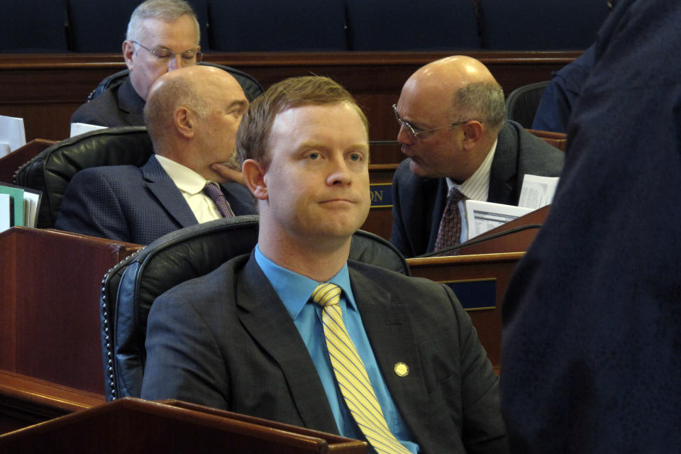 FILE - Alaska state Rep. David Eastman, R-Wasilla, sits in the House on April 29, 2022, in Juneau, Alaska. Eastman, accused of violating the state constitution's disloyalty clause over his lifetime membership in Oath Keepers, has not condemned the organization in the wake of the Jan. 6, 2021, insurrection at the U.S Capitol. "No, I generally don't condemn groups," Eastman, a Wasilla Republican, said during his bench hearing on Thursday, Dec. 15, 2022, his second day on the witness stand. (AP Photo/Becky Bohrer, File)