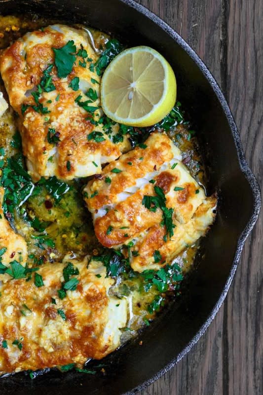 <p>The Mediterranean Dish</p><p>This easy baked cod recipe comes together in just over 20 minutes, but there is a reason it is a big fan favorite! Tender, perfectly flaky cod, tossed in bold Mediterranean spices and baked with a tasty garlic and lemon sauce.</p><p><strong>Get the recipe: <a href="https://www.themediterraneandish.com/baked-cod-recipe-lemon-garlic/" rel="nofollow noopener" target="_blank" data-ylk="slk:Baked Cod with Lemon and Garlic;elm:context_link;itc:0;sec:content-canvas" class="link rapid-noclick-resp"><em>Baked Cod with Lemon and Garlic</em></a></strong></p><p><strong>Related: <a href="https://parade.com/1342450/kristamarshall/baked-fish-recipes/" rel="nofollow noopener" target="_blank" data-ylk="slk:40 Baked Fish Recipes;elm:context_link;itc:0;sec:content-canvas" class="link rapid-noclick-resp">40 Baked Fish Recipes</a></strong></p>