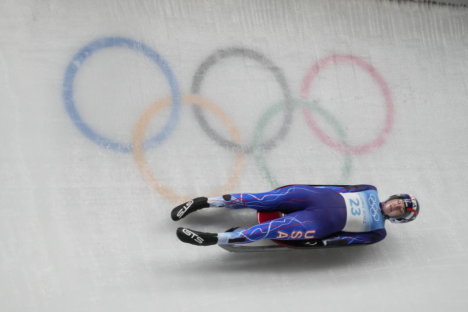 FILE - Summer Britcher, of the United States, slides during the luge women's singles run 3 at the 2022 Winter Olympics, Tuesday, Feb. 8, 2022, in the Yanqing district of Beijing. Summer Britcher and Emily Sweeney have been USA Luge teammates for years. They’ve traveled together, they’ve competed together, they’ve gone to the Olympics together, they’ve stood on World Cup podiums together. Being on a sled together was not part of the plan.(AP Photo/Dmitri Lovetsky, File)