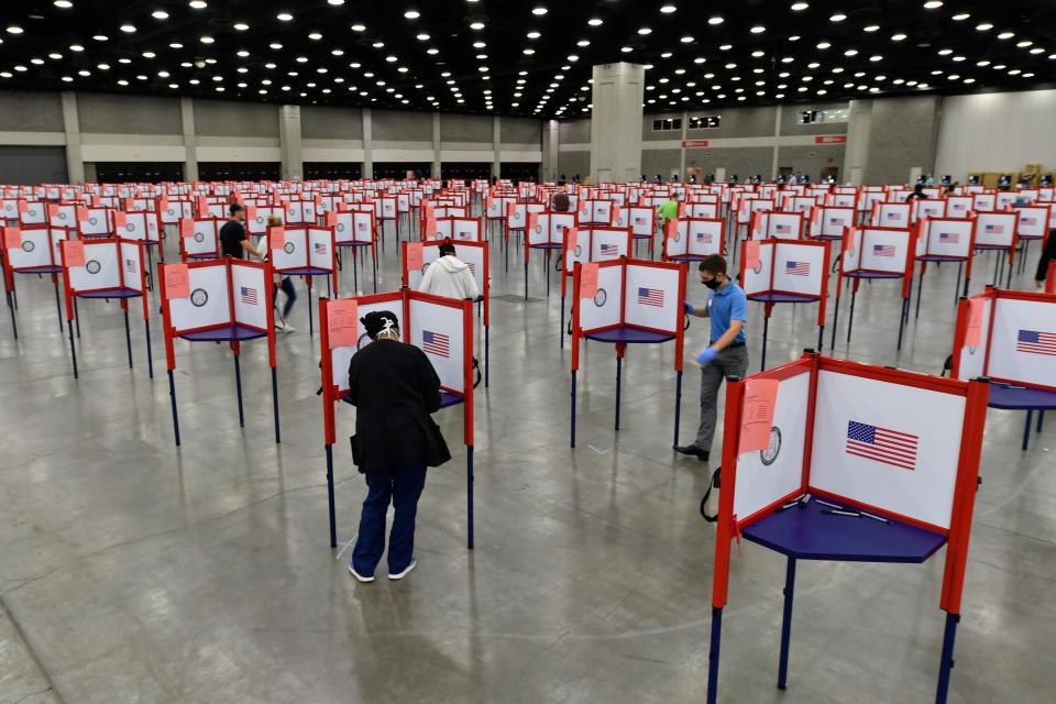 In this June 23, 2020, photo voting stations are set up in the South Wing of the Kentucky Exposition Center for voters to cast their ballot in the Kentucky primary in Louisville, Ky.