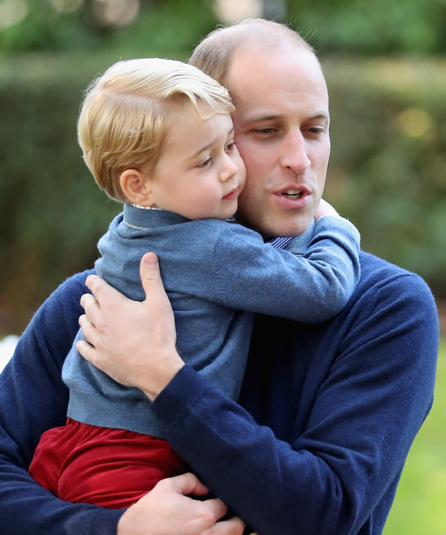 The 3-year-old gets a hug from dad