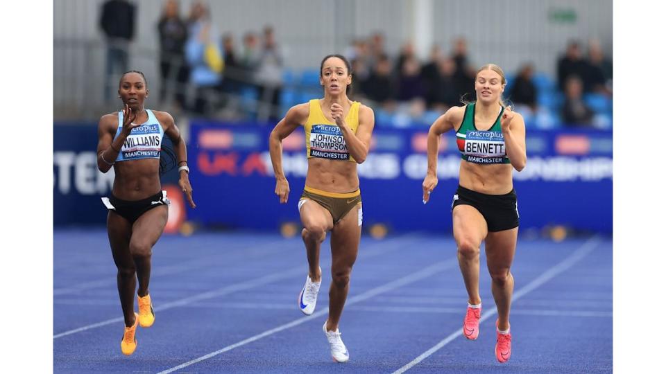 Katarina Johnson-Thompson running alongside two other athletes