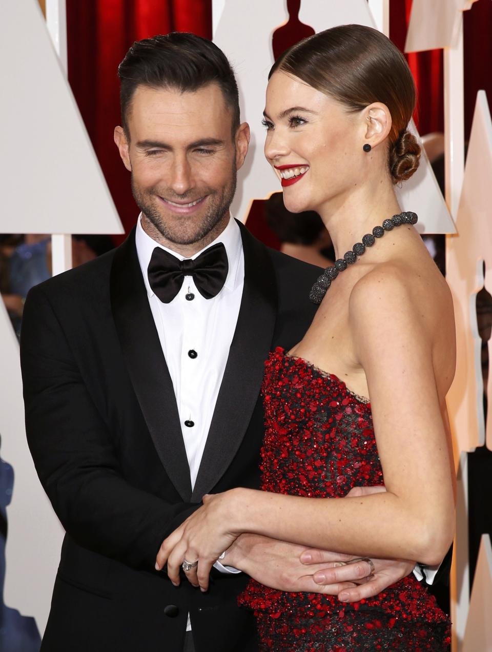 Singer Adam Levine and his wife Behati Prinsloo arrive at the 87th Academy Awards in Hollywood, California
