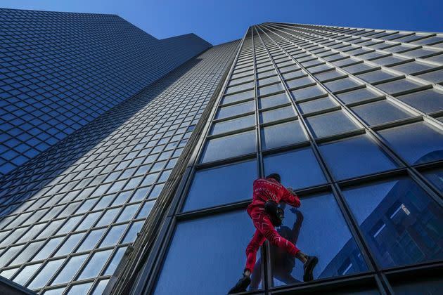 Alain Robert said he wanted to call attention to climate change when he climbed the 48-story skyscraper in Paris. (Photo: Michel Euler via Associated Press)