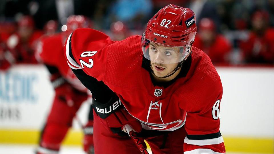 Carolina Hurricanes’ Jesperi Kotkaniemi (82) waits for a face-off against the New York Islanders during the second period of an NHL hockey game in Raleigh, N.C., Thursday, Oct. 14, 2021. (AP Photo/Karl B DeBlaker)