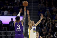 Utah Jazz guard Keyonte George (3) shoots against Golden State Warriors forward Gui Santos (15) during the first half of an NBA basketball game in San Francisco, Sunday, April 14, 2024. (AP Photo/Jed Jacobsohn)