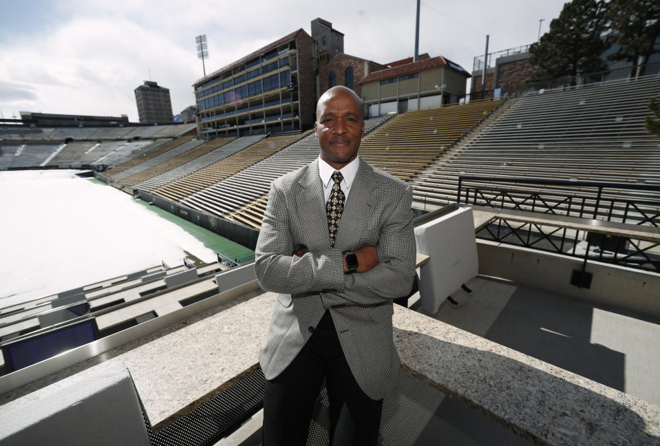 Karl Dorrell poses for a photograph overlooking Folsom Field after a news conference to announce that he is the new NCAA college head football coach at Colorado during a news conference Monday, Feb. 24, 2020, in Boulder, Colo. (AP Photo/David Zalubowski)