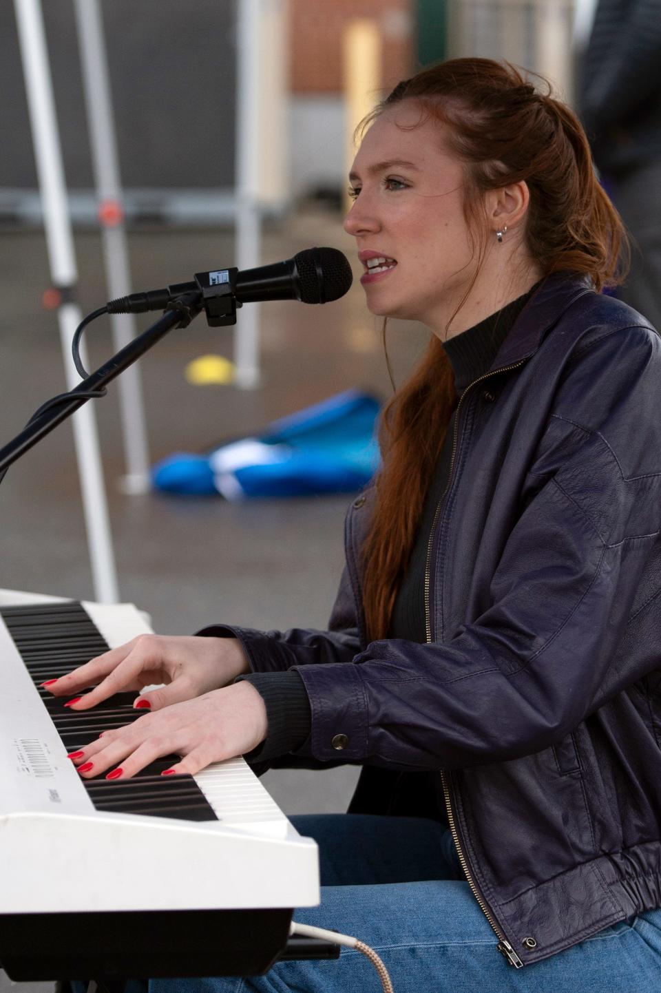 Mackenzie Lee Clement performs outside Jack's Abby during activities in conjunction with Downtown Framingham, Inc., April 17.