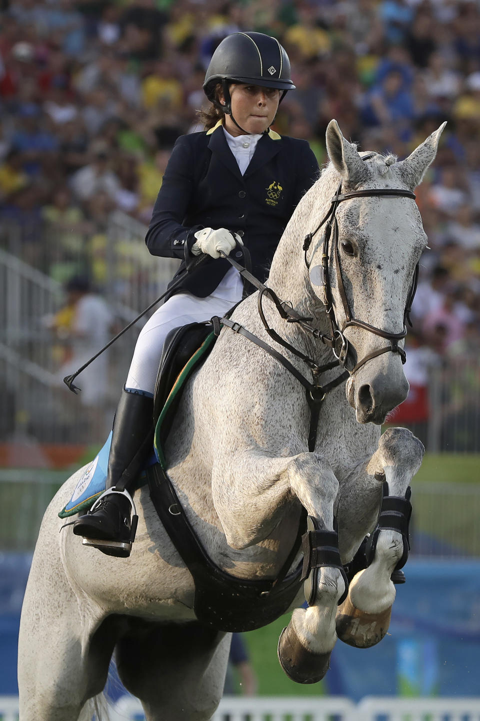 FILE - In this Aug. 19, 2016, file photo, gold medal winner Chloe Esposito of Australia competes in the equestrian portion of the women's modern pentathlon at the Summer Olympics in Rio de Janeiro, Brazil. Esposito announced in late January that a “wonderful, unexpected surprise” had occurred and that the Australian wouldn’t be able to defend her modern pentathlon gold medal at the Tokyo Olympics. She was pregnant with her first child. Two months later Esposito and thousands of other Olympic athletes learned that the Tokyo Games would be put off by a year until July 2021 because of the coronavirus pandemic. While for some it meant more time to recover from injuries or extra time to prepare, Esposito realized it might give her a second chance to be in Tokyo next year. (AP Photo/Kirsty Wigglesworth, File)