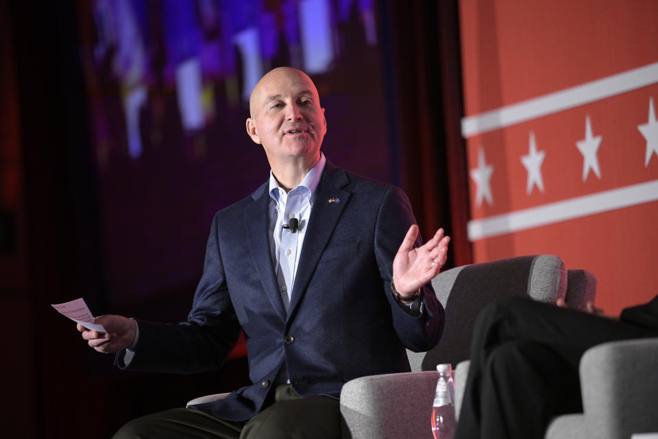 FILE - Nebraska Gov. Pete Ricketts poses a question fellow governors taking part in a panel discussion during a Republican Governors Association conference, Nov. 15, 2022, in Orlando, Fla. Ricketts is expected to be appointed to the state's U.S. Senate seat being vacated by fellow Republican Ben Sasse. His appointment would come from a new governor Ricketts helped get elected. (AP Photo/Phelan M. Ebenhack, File)