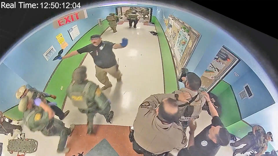 Law enforcement officers are seen in a hallway of Robb Elementary School in Uvalde, Texas, on May 24.