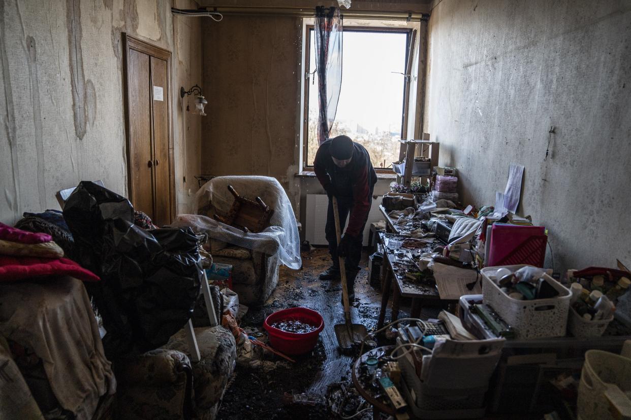 resident cleans rubble from damaged house as several residential buildings are damaged following a Russian airstrike in Kyiv (Anadolu via Getty Images)