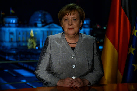 German Chancellor Angela Merkel poses for a photograph