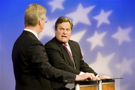 Challenger Bryan Smith (L) and incumbent Congressman Mike Simpson (R-ID) participate in a televised debate for the upcoming Republican primary election at the studios of Idaho Public Television in Boise, Idaho May 11, 2014. REUTERS/Patrick Sweeney