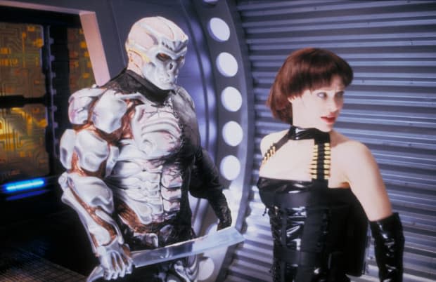 Kane Hodder as Jason Voorhees and Lisa Ryder as Kay-Em 14 in "Jason X" (2001)<p>New Line Cinema</p>