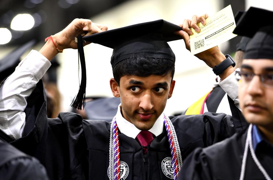 WORCESTER - Jai Patel of Billerica adjusts his cap during Worcester Polytechnic Institute's Undergraduate Commencement Ceremony at DCU Center on Friday.