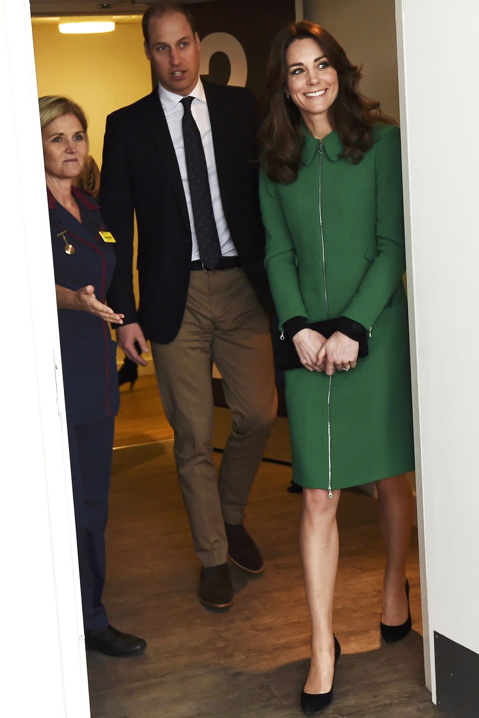 <p>Kate Middleton looked chic in a bright green coat and black pumps, while visiting St Thomas' Hospital in London to work towards preventing suicide with Prince William. </p>