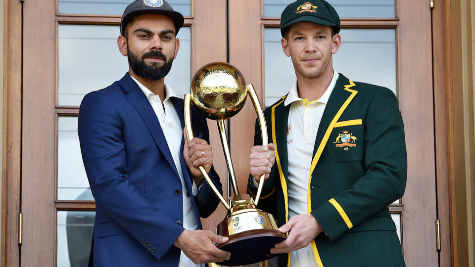 Virat Kohli and Tim Paine. (Photo by PETER PARKS/AFP/Getty Images)