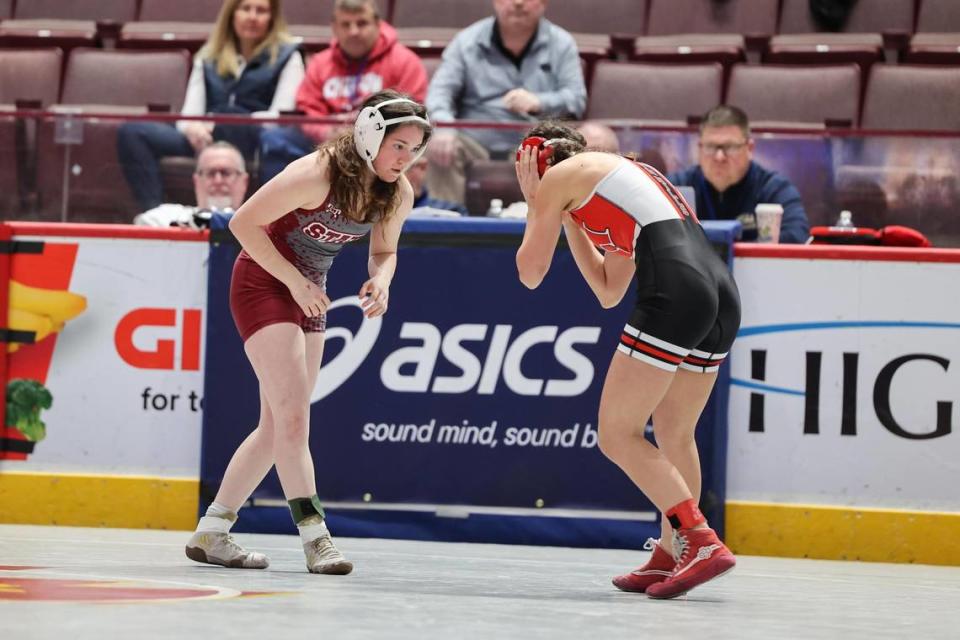 State College’s Anna Lackey looks for an opening on North Hills’ JoAnna Saad in their 106-pound PIAA girls consolation first round match on Friday, March 8, 2024 at the Giant Center in Hershey. Lackey pinned Saad in 2:14.