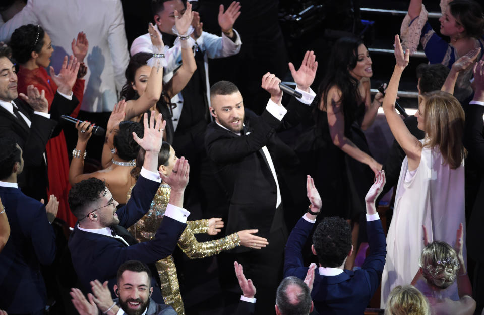 FILE - Justin Timberlake, center, performs in the audience during the opening at the Oscars on Sunday, Feb. 26, 2017, at the Dolby Theatre in Los Angeles. (Photo by Chris Pizzello/Invision/AP, File)