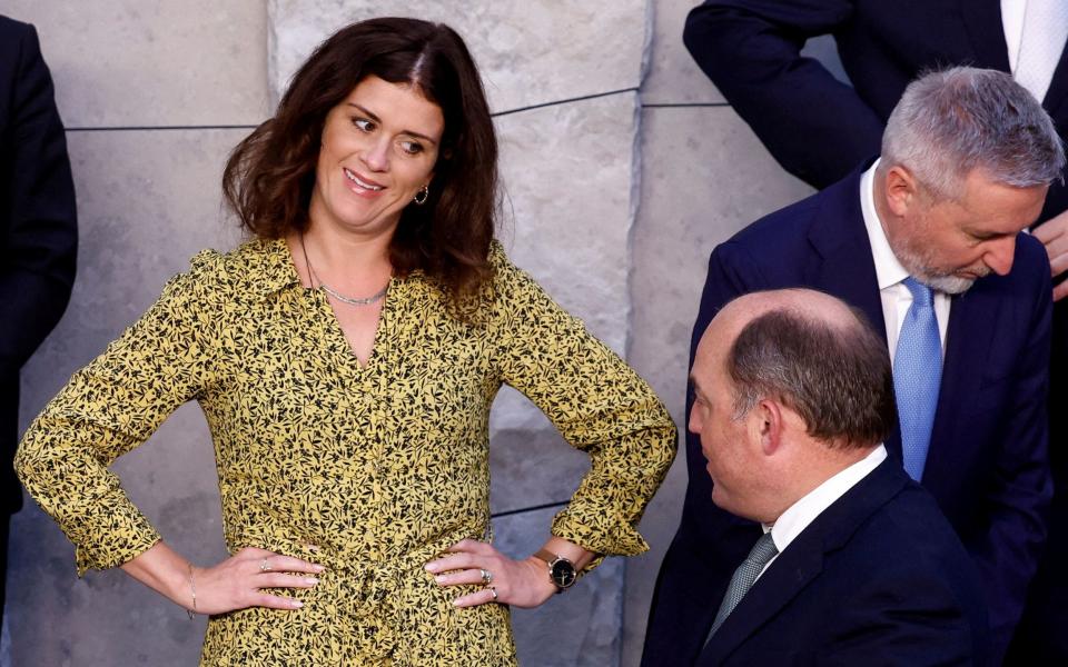 Ben Wallace, the Defence Secretary, shares a light-hearted moment with Thordis Kolbrun Reykfjord Gylfadottir, Iceland's foreign minister, at the Nato summit - Reuters