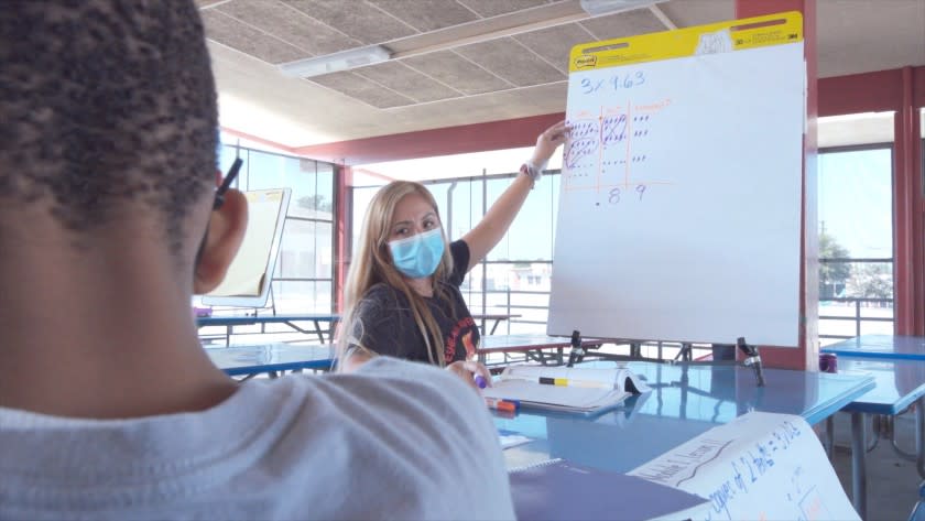 Fifth-grade teacher Maria Smith tutors a student at Eshelman Elementary in Lomita in the fall semester of 2020