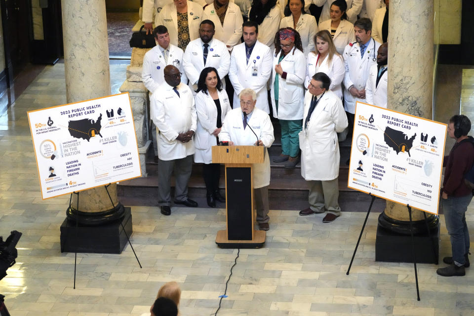 At a news conference inside the Mississippi Capitol, Dr. John Mitchell, center, president of the Mississippi State Medical Association, and flanked by area physicians, called for state leaders to work with health officials to improve Mississippi's status as the nation's unhealthiest state across several metrics, Thursday, Jan. 18, 2024, in Jackson, Miss. (AP Photo/Rogelio V. Solis)