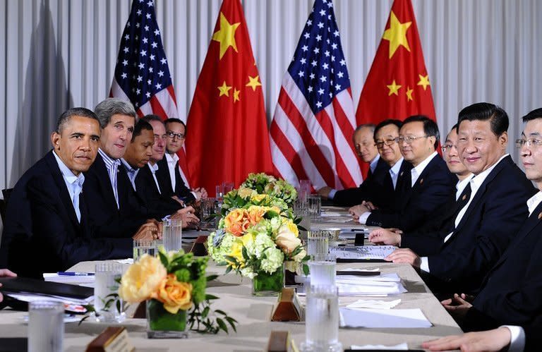 US President Barack Obama (L) and Chinese President Xi Jinping (R), along with their delegates, hold a meeting at the Annenberg Retreat in Rancho Mirage, California, on June 8, 2013. Obama and Xi ended their first US-China summit, forging a rapport and policy understandings, if not breakthroughs, on North Korea, climate and cyber issues