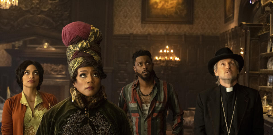 This image released by Disney Enterprises shows, from left, Rosario Dawson, Tiffany Haddish, LaKeith Stanfield and Owen Wilson in a scene from "Haunted Mansion." (Jalen Marlowe/Disney Enterprises via AP)