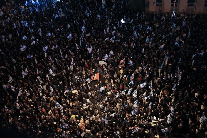 Israelis protest against the plans by Prime Minister Benjamin Netanyahu's new government to overhaul the judicial system, in Tel Aviv, Israel, Saturday, Feb. 4, 2023. (AP Photo/Maya Alleruzzo)