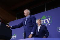 President Joe Biden arrives to speak at a campaign event for Virginia democratic gubernatorial candidate Terry McAuliffe, right, at Lubber Run Park, Friday, July 23, 2021, in Arlington, Va. (AP Photo/Andrew Harnik)