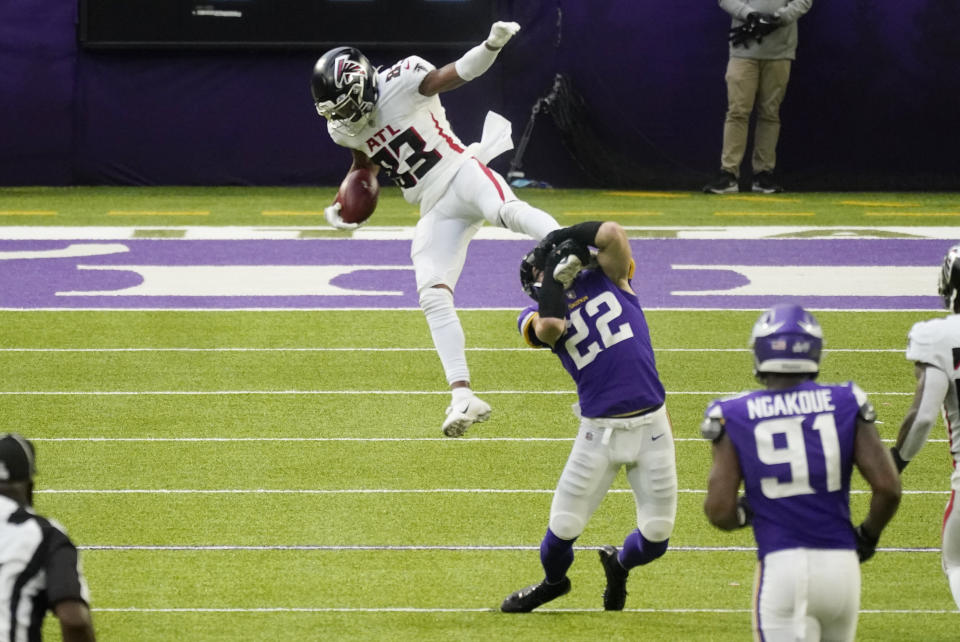 Atlanta Falcons wide receiver Russell Gage (83) is tackled by Minnesota Vikings safety Harrison Smith (22) after catching a pass during the first half of an NFL football game, Sunday, Oct. 18, 2020, in Minneapolis. (AP Photo/Jim Mone)