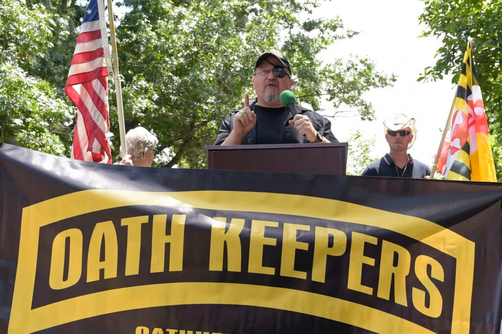 Stewart Rhodes, founder of the Oath Keepers, center, speaks during a rally outside the White House in Washington, June 25, 2017. (AP Photo/Susan Walsh, File)