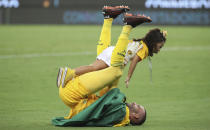 Goalkeeper Weverton of Brazil's Palmeiras celebrates with his daughter after winning the Copa Libertadores final soccer match against Brazil's Santos at the Maracana stadium in Rio de Janeiro, Brazil, Saturday, Jan. 30, 2021. Palmeiras won 1-0. (Ricardo Moraes/Pool via AP)