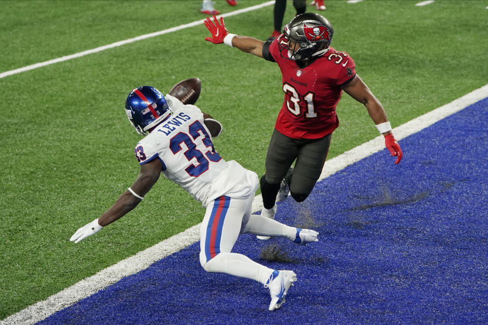 Tampa Bay Buccaneers' Antoine Winfield Jr., right, breaks up a two-point conversion-attempt to New York Giants' Dion Lewis during the second half of an NFL football game, Monday, Nov. 2, 2020, in East Rutherford, N.J. (AP Photo/Corey Sipkin)