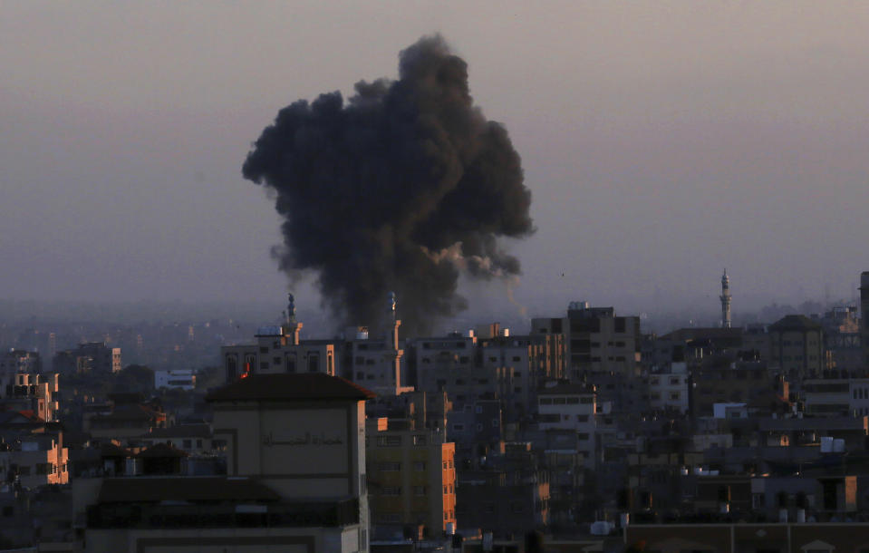 Smoke rises following Israeli airstrikes in Gaza City, Thursday, May 13, 2021. Weary Palestinians are somberly marking the end of the Muslim holy month of Ramadan, as Hamas and Israel traded more rockets and airstrikes and Jewish-Arab violence raged across Israel. (AP Photo/Adel Hana)