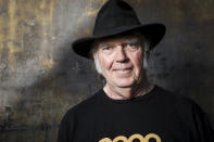 FILE - In this May 18, 2016 file photo, Neil Young poses for a portrait in Calabasas, Calif. Young is among several musicians who are objecting to their songs being used at President Donald Trump's campaign rallies. (Photo by Rich Fury/Invision/AP, File)