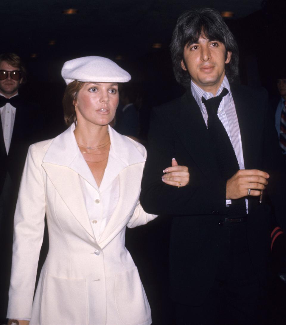 priscilla presley wearing a white dress and hat