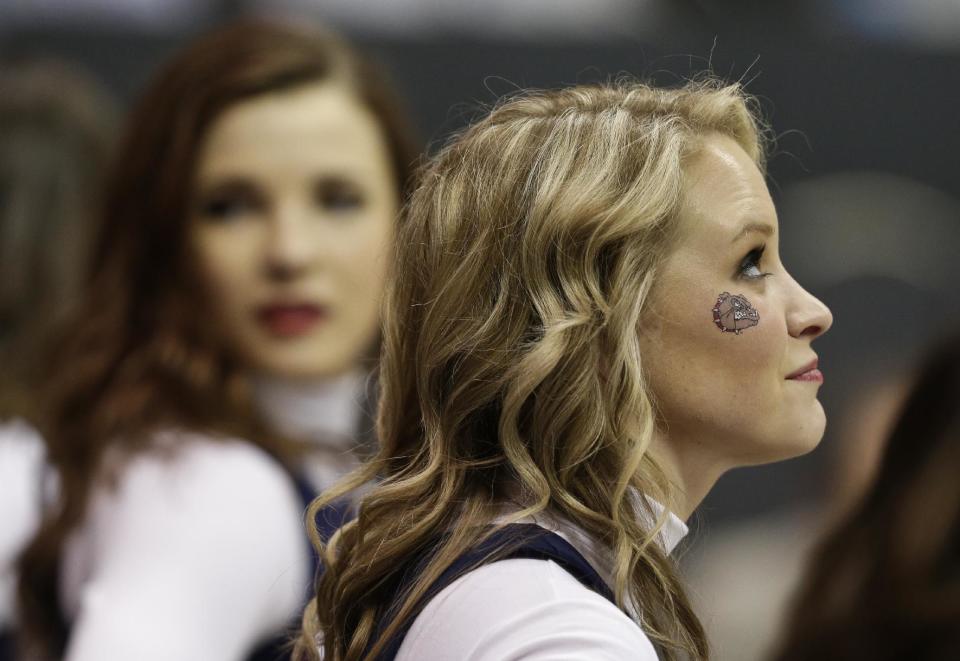 A Gonzaga cheerleader wears a bulldog decal during the first half in a second-round game in the NCAA college basketball tournament Friday, March 21, 2014, in San Diego. (AP Photo/Gregory Bull)