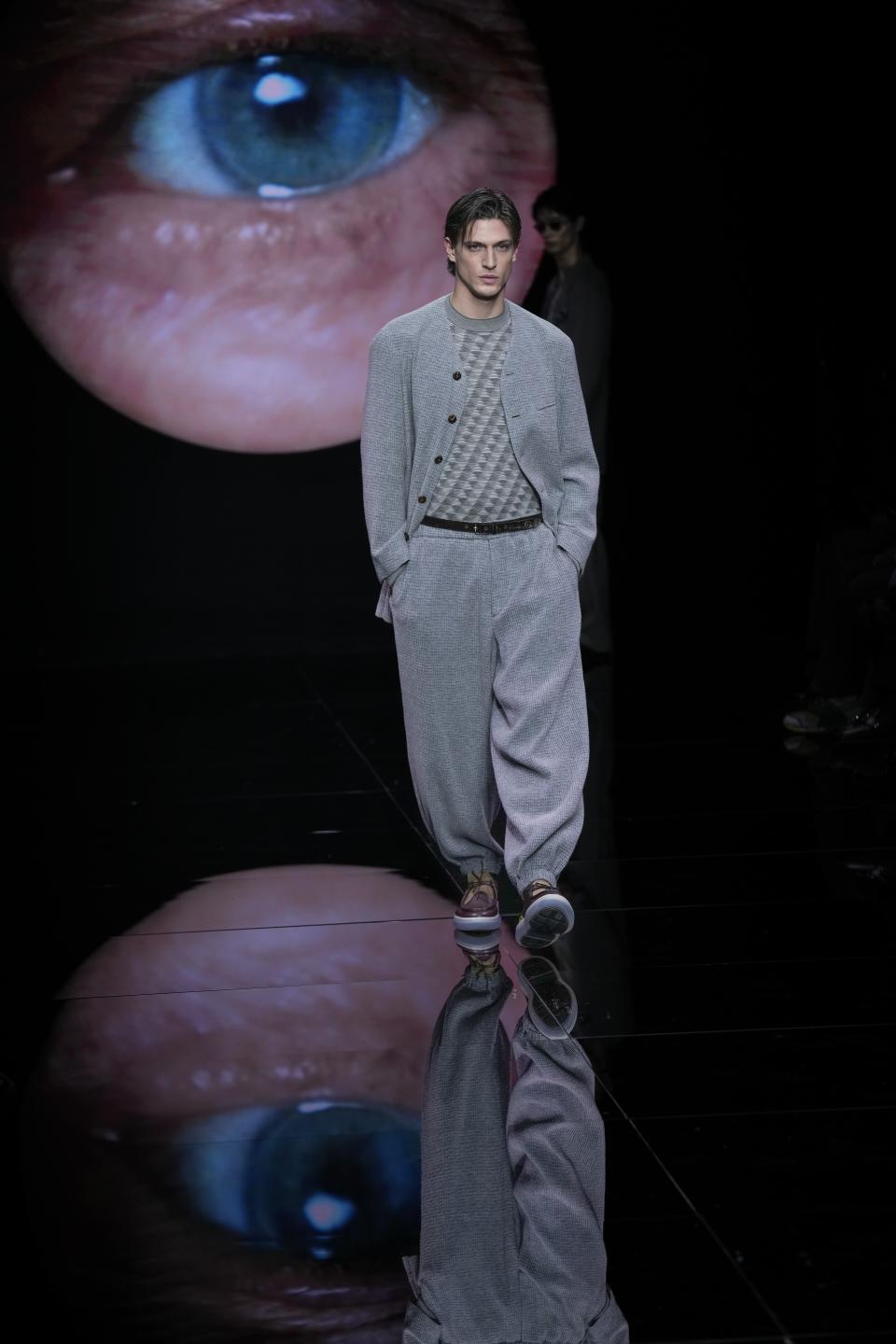 A model wears a creation as part of the men's Giorgio Armani Fall-Winter 2024-2025 collection, that was presented in Milan, Italy, Monday, Jan. 15, 2024. (AP Photo/Antonio Calanni).