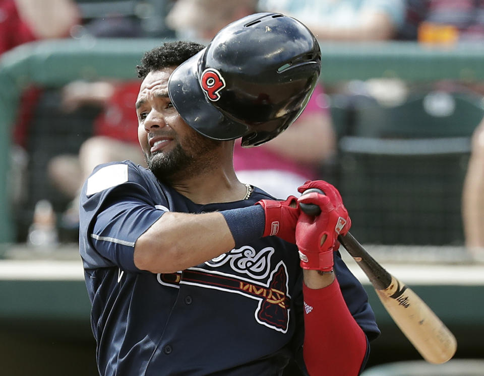Atlanta Braves' Andres Blanco loses his helmet while swinging at a pitch in the third inning of a spring baseball exhibition game against the Houston Astros, Monday, March 4, 2019, in Kissimmee, Fla. (AP Photo/John Raoux)